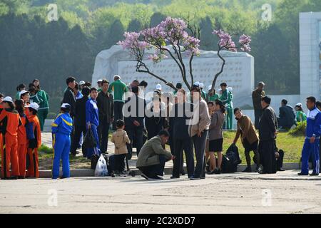 Pyongyang, North Korea - May 1, 2019: People gather on a square to celebrate May 1st Labor Day on the Pyongyang street Stock Photo