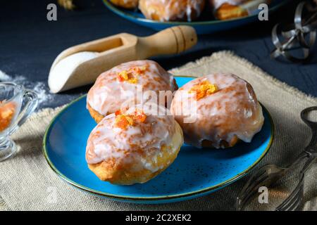 Fine Berlin donuts with jam filling and icing Stock Photo