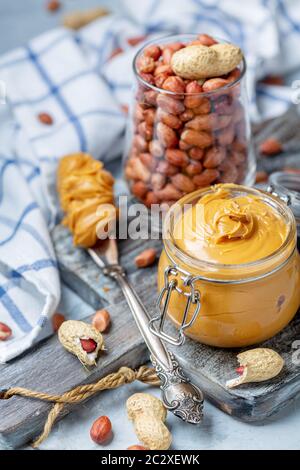 Homemade peanut butter in a glass jar. Stock Photo