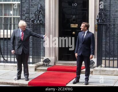 London, UK. 18th June, 2020. French President, Emmanuel Macron, meets UK Prime Minister, Boris Johnson, at Downing Street for talks. During their meeting they will discuss easing the 14-Day Cornavirus quarantine measures. President Macron is commemorating the 80th anniversary of wartime leader, Charles De Gaulle's BBC broadcast to occupied France after the 1940 invasion. Four French resisitance fighters will be awarded honorary MBEs. Credit: Tommy London/Alamy Live News Stock Photo
