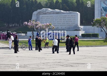 Pyongyang, North Korea - May 1, 2019: People play badminton on May 1st Labor Day on the street in Pyongyang Stock Photo