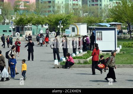 Pyongyang, North Korea - May 1, 2019: Local people shown on the street in Pyongyang suburb at morning time Stock Photo