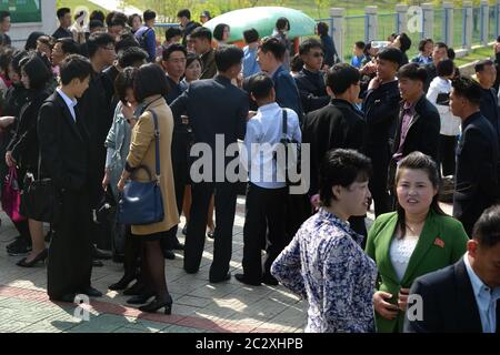 Pyongyang, North Korea - May 1, 2019: People gather to celebrate May 1st Labor Day on the Pyongyang street Stock Photo