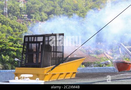 Pollution by engine exhaust of ferry in Indonesia. Diesel engine smoke pollution of environment Stock Photo