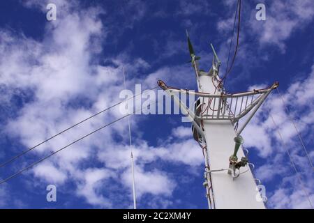 Metal boat mast with wires and antennas. conceptual image for industrial themes in technology, telecommunications, cellular data transfer and transmit Stock Photo