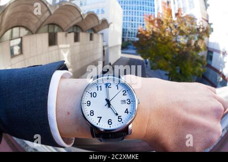 Businessman looking at his watch Stock Photo