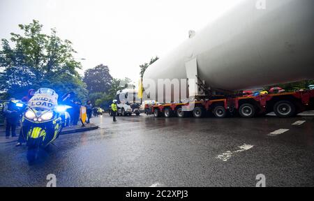 An empty colossal-sized ‘Air Liquide’ medical grade oxygen tank being transported on a 164ft (50m) lorry across Four Oaks, Sutton Coldfield. Stock Photo