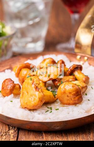 italian risotto with chanterelles on wood Stock Photo