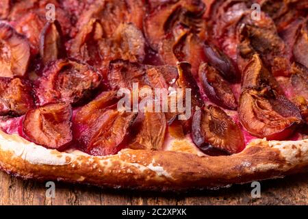 bavarian plum pie on dark wood Stock Photo