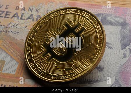 New Zealand currency with the bitcoin symbol Stock Photo