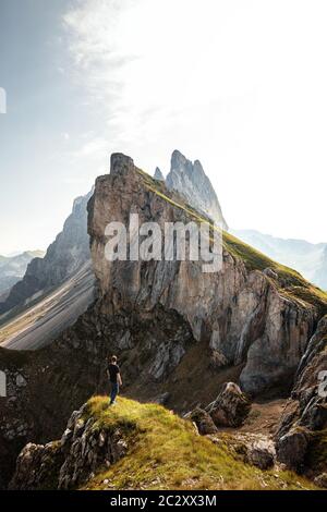 Hiking Along the Famous Green and Rocky Seceda Ridge in the Dolomites of Northern Italy. Popular Travel Destination Stock Photo