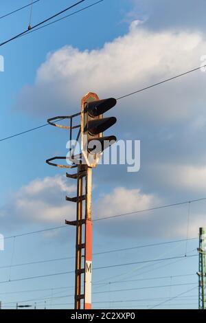 Railway traffic signal light against bly sky Stock Photo