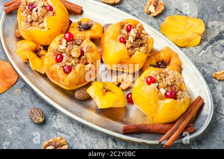 Fruit dessert baked quince stuffed with nut and raisin.Baked quince.Autumn food Stock Photo
