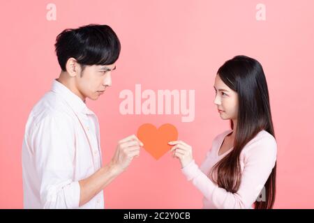 young anger couple fighting for a love hearted Stock Photo