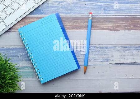 high angle view of notepad with pencil on table  Stock Photo