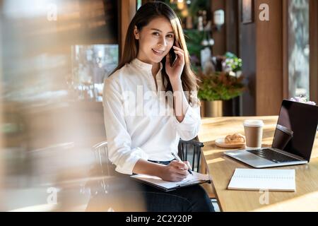 Freelancer woking at cafe Stock Photo