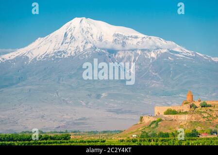Big Ararat with a snow-capped peak and the monastery of Khor Virap, a tourist attraction of Armenia Stock Photo
