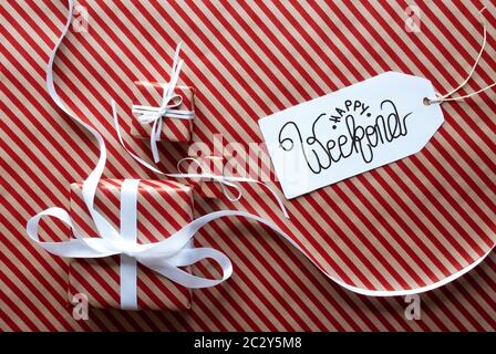 Label With English Text Happy Weekend. Gifts And Presents On Red And White Wrapping Paper Stock Photo