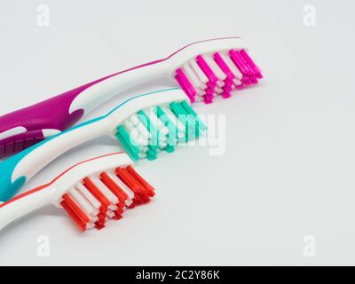 three toothbrushes on white background Stock Photo
