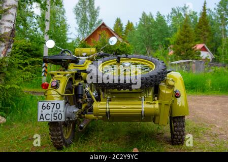 Restored bright green retro motorcycle with sidecar Stock Photo