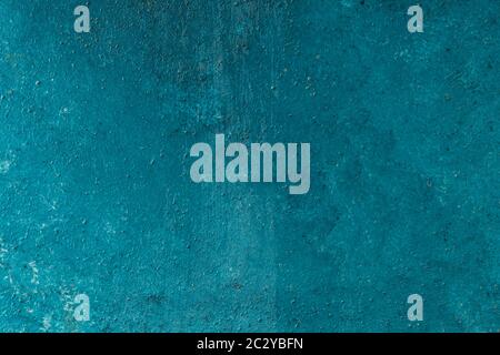 grungy stucco wall background paited blue with white patterns Stock Photo