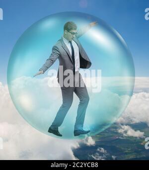 Businessman flying inside the bubble Stock Photo