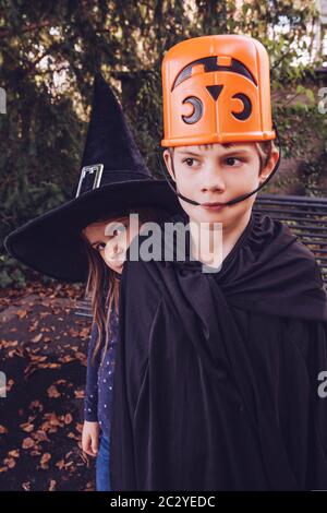 Brother and sister being silly and getting ready to go out for Halloween. Stock Photo