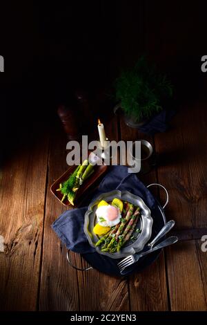 delicious green asparagus wrapped in bacon and egg Stock Photo