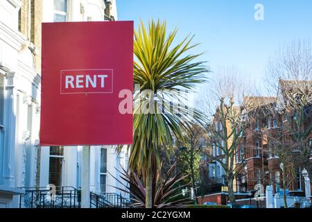 Home rent sign on suburban residential street Stock Photo