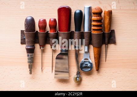 Leather Craft Tools On Wall In Tailoring Workshop Stock Photo