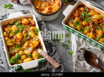 Super fast and delicious food, gratinated gnocchi with minced meat, tomatoes and cheese Stock Photo