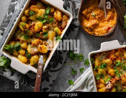 Super fast and delicious food, gratinated gnocchi with minced meat, tomatoes and cheese Stock Photo