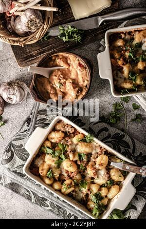 Super fast and delicious food, gratinated gnocchi with minced meat, tomatoes and cheese Stock Photo