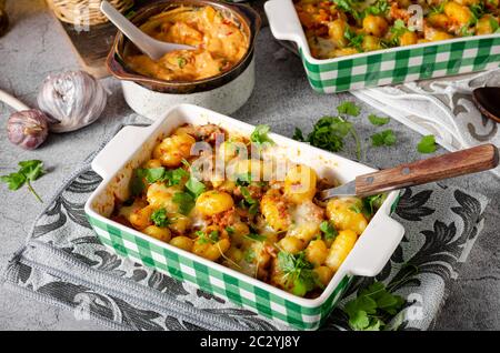 Super fast and delicious food, gratinated gnocchi with minced meat, tomatoes and cheese Stock Photo