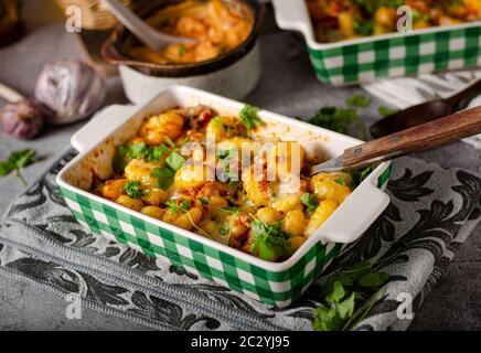 Super fast and delicious food, gratinated gnocchi with minced meat, tomatoes and cheese Stock Photo