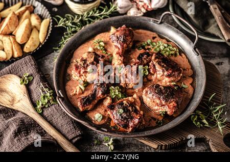 Original tikka chicken with hot sauce and butter, fresh garlic and herbs Stock Photo