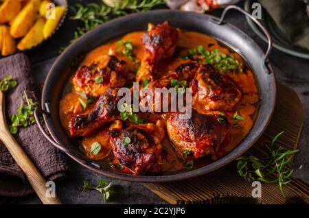 Original tikka chicken with hot sauce and butter, fresh garlic and herbs Stock Photo