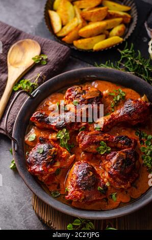 Original tikka chicken with hot sauce and butter, fresh garlic and herbs Stock Photo