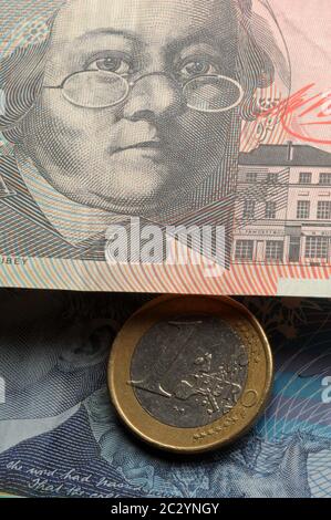 One euro coin on Australian banknotes Stock Photo