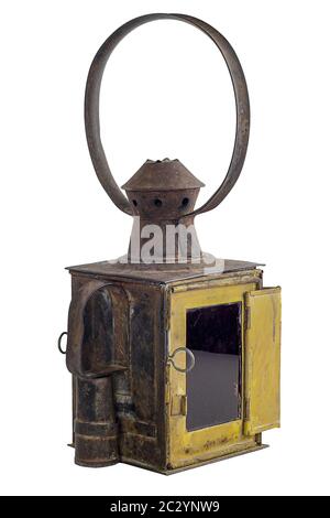 Old yellow rusty railroad lantern. Isolated on white Stock Photo