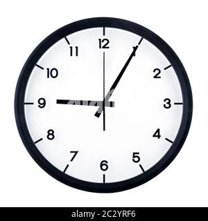Classic analog clock pointing at nine O five, isolated on white background. Stock Photo