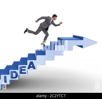 Concept of idea with businessman climbing steps stairs Stock Photo