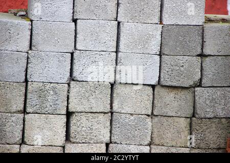 Frontal view of stack of concrete blocks piled up vertically Stock Photo