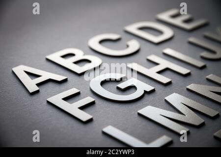 Alphabet detail made with solid letters on a blackboard Stock Photo