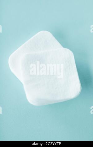 Organic cotton pads on mint background, cosmetics and make-up remover, hygiene and skincare beauty brand product for healthcare Stock Photo