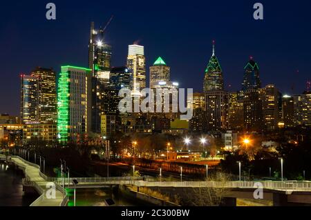 Cityscape of Philadelphia and green Philadelphia Eagles lights on buildings at night, 2018, Pennsylvania, USA Stock Photo