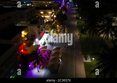 Aerial night photo tourists returning to Miami Beach during phase 1 reopening Coronavirus Covid 19 pandemic 2020 Stock Photo