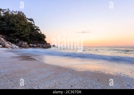 sunrise in Marble beach, Thassos, Greece. The most beautiful white beach in Greece Stock Photo