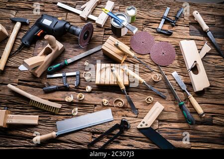 Various Carpenter Tools From Toolkit Laying On Desk Stock Photo