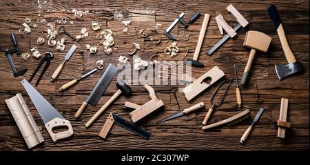 Various Carpenter Tools From Toolkit Laying On Desk Stock Photo